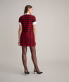 Model is wearing UNTUCKit Valentina dress in red tweed houndstooth. 