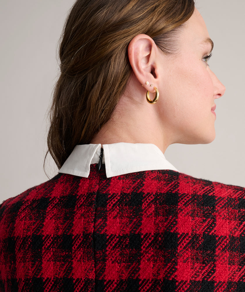 Model is wearing UNTUCKit Valentina dress in red tweed houndstooth. 