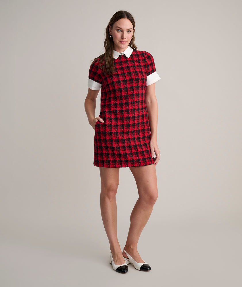Model is wearing UNTUCKit Valentina dress in red tweed houndstooth. 