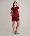 Model is wearing UNTUCKit Valentina dress in red tweed houndstooth. 