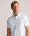 Model is wearing UNTUCKit Performance Short-Sleeve Van Meter Shirt in Green Shell Print.