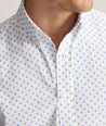 Model is wearing UNTUCKit Performance Short-Sleeve Van Meter Shirt in Green Shell Print.