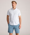 Model is wearing UNTUCKit Performance Short-Sleeve Van Meter Shirt in Green Shell Print.