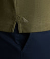 Model is wearing UNTUCKit Vargas WF Polo in Heather Olive.