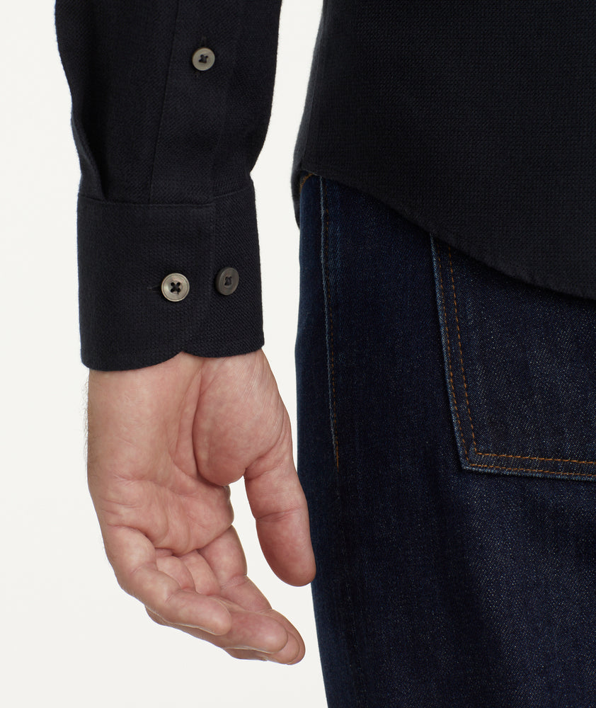 Model is wearing UNTUCKit Wrinkle-Free Veneto Shirt in black.