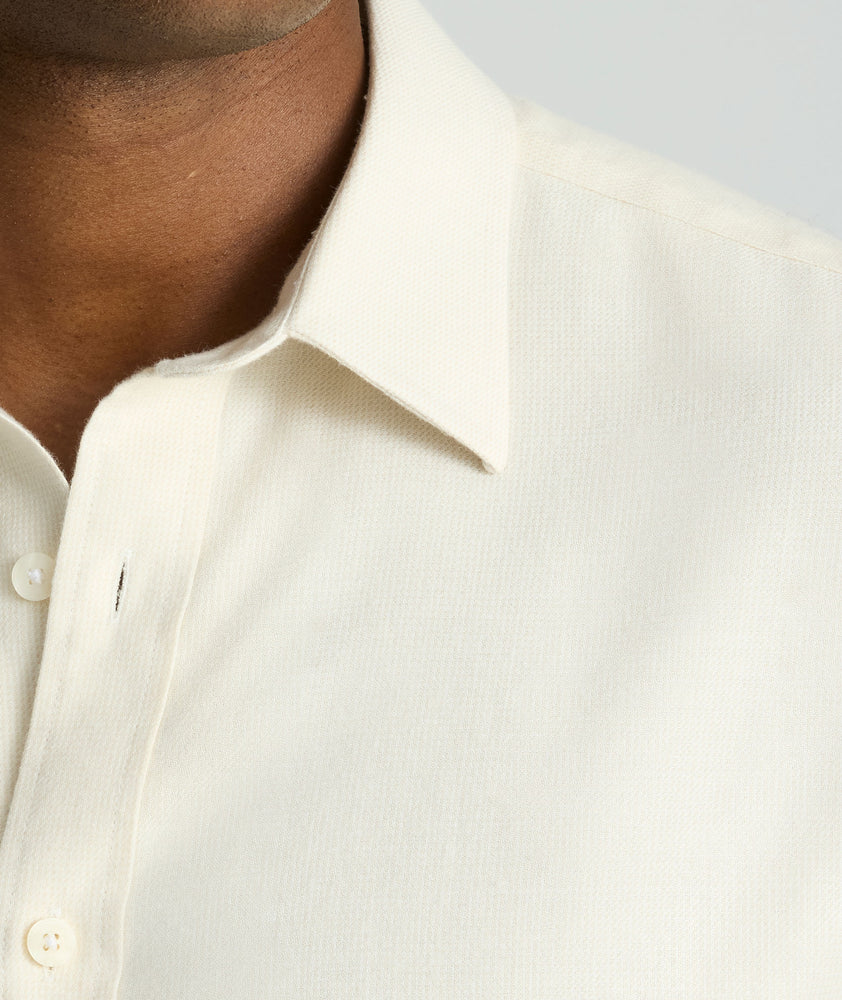 Model is wearing UNTUCKit Wrinkle-Free Veneto Shirt in egret.