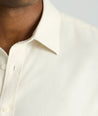 Model is wearing UNTUCKit Wrinkle-Free Veneto Shirt in egret.