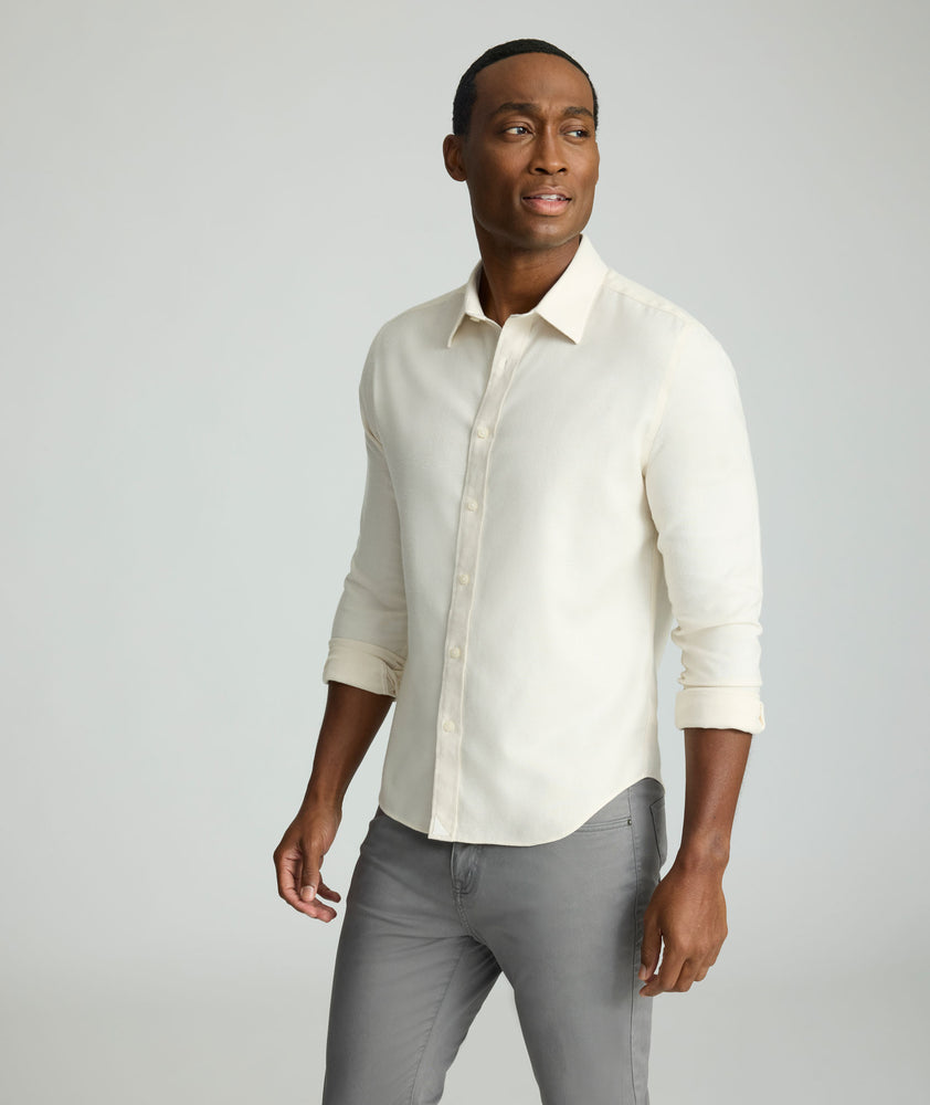 Model is wearing UNTUCKit Wrinkle-Free Veneto Shirt in egret.