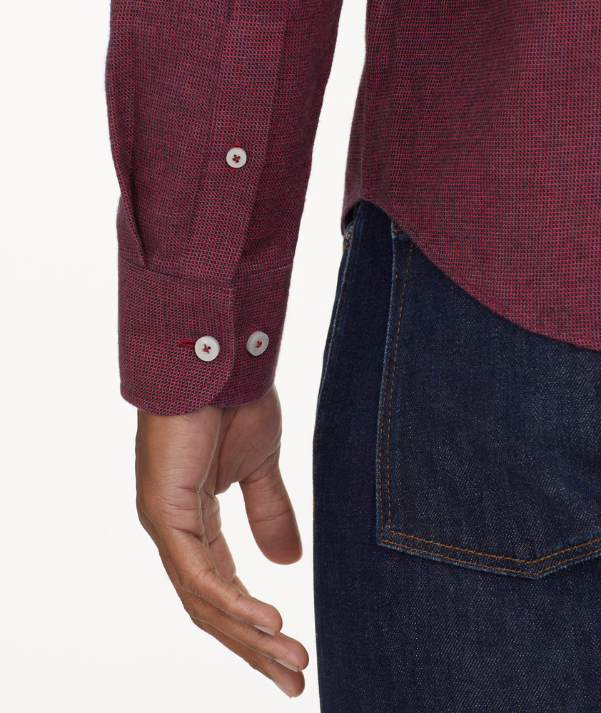 Model is wearing UNTUCKIt Wrinkle-Free Veneto Shirt in dark berry.
