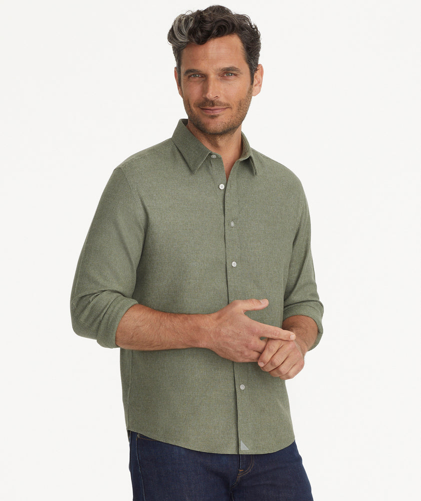 Model is wearing UNTUCKit Wrinkle-Free Veneto Shirt in Textured Forest Green.