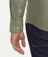 Model is wearing UNTUCKit Wrinkle-Free Veneto Shirt in Textured Forest Green.