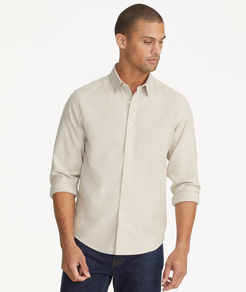 Model is wearing UNTUCKit Wrinkle-Free Veneto Shirt in Textured Light Tan.