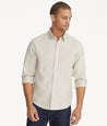 Model is wearing UNTUCKit Wrinkle-Free Veneto Shirt in Textured Light Tan.