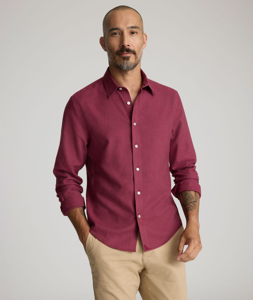 Model is wearing UNTUCKit Veneto wrinkle-free shirt in Rhododendron. 