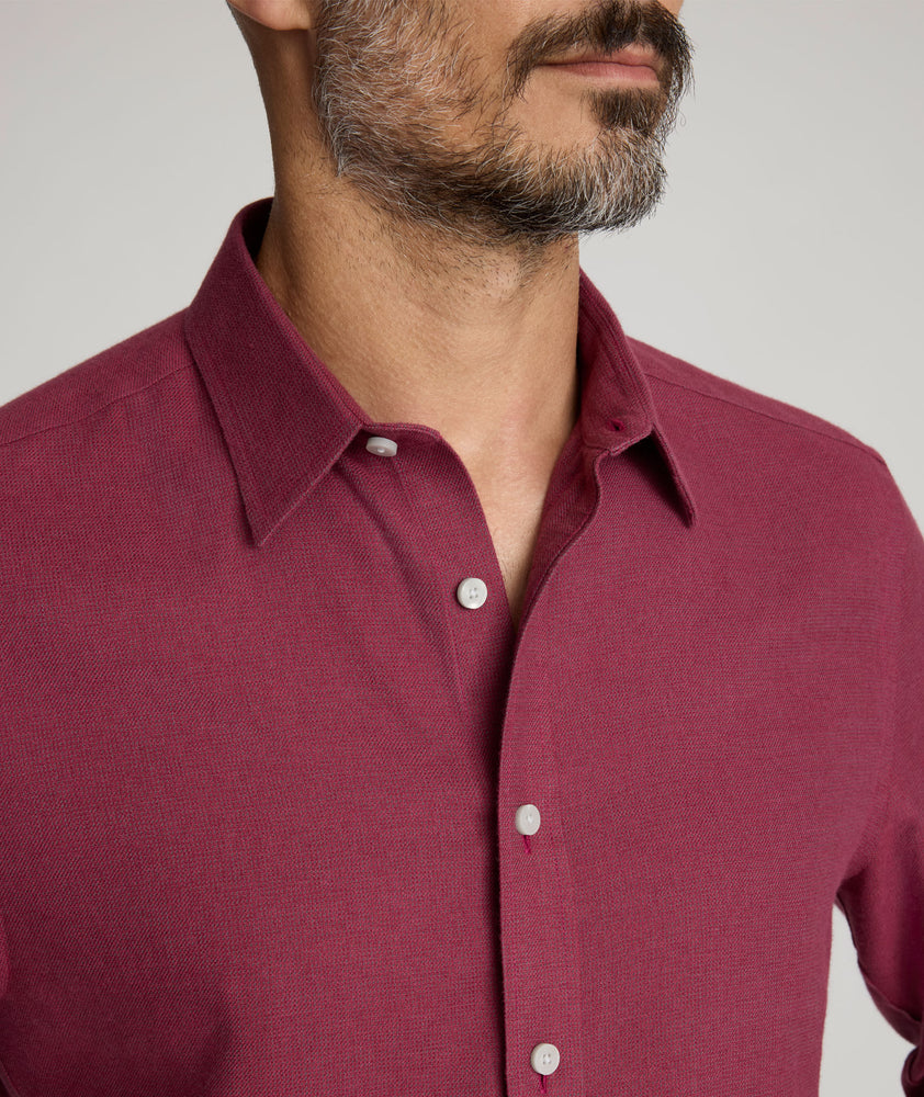 Model is wearing UNTUCKit Veneto wrinkle-free shirt in Rhododendron. 