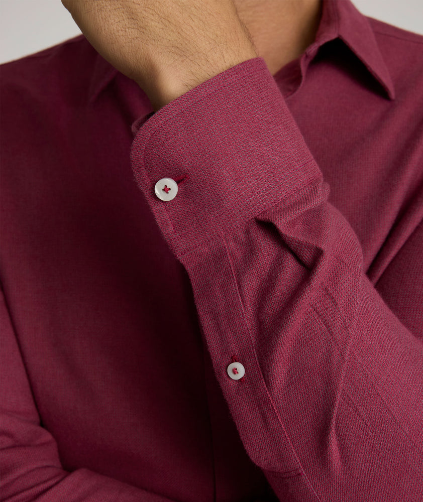 Model is wearing UNTUCKit Veneto wrinkle-free shirt in Rhododendron. 