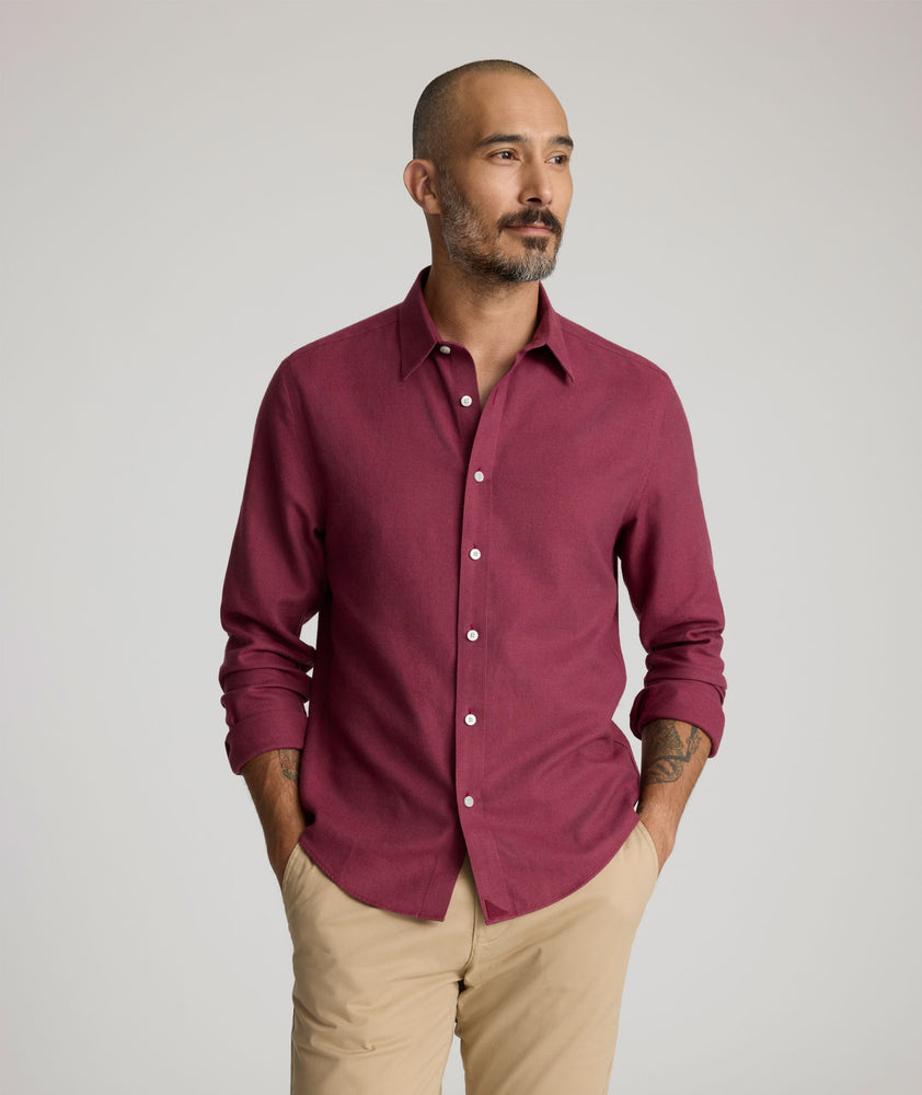 Model is wearing UNTUCKit Veneto wrinkle-free shirt in Rhododendron. 