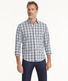 Model is wearing UNTUCKit Wrinkle-Free Performance Verdello Shirt in White & Navy Plaid.