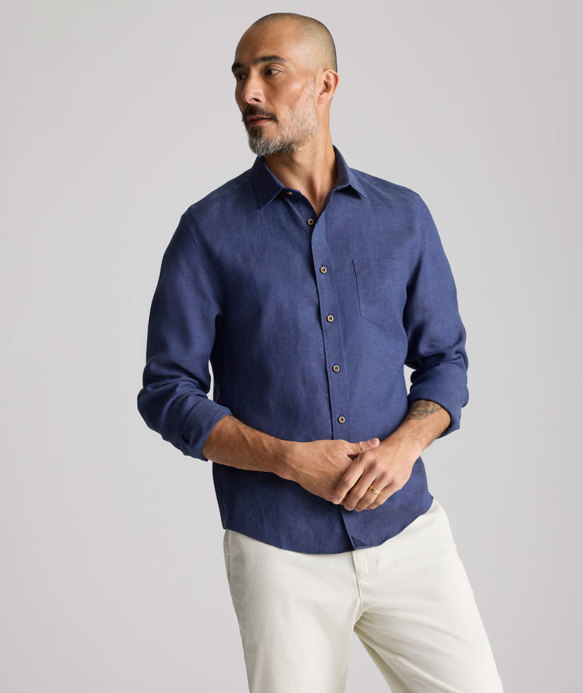 Model wearing an UNTUCKit Navy Wrinkle-Resistant Linen Vin Santo Shirt