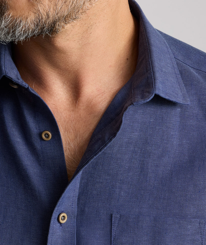 Model wearing an UNTUCKit Navy Wrinkle-Resistant Linen Vin Santo Shirt