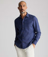 Model wearing an UNTUCKit Navy Wrinkle-Resistant Linen Vin Santo Shirt