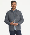 Model is wearing UNTUCKit Vinifera jacket in navy.