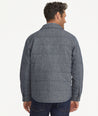 Model is wearing UNTUCKit Vinifera jacket in navy.