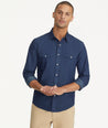 Model is wearing UNTUCKit Wrinkle-Free Wade Shirt in Western Dark Blue Chambray.