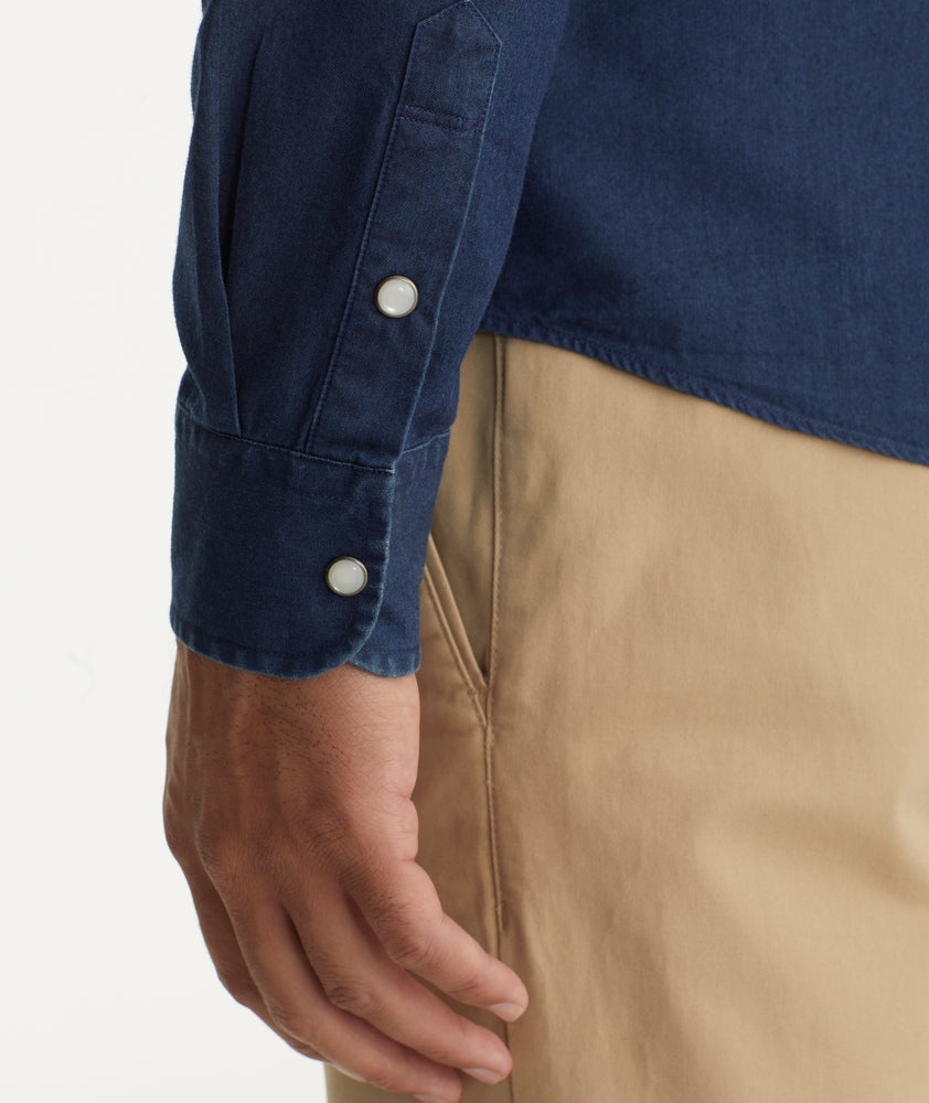 Model is wearing UNTUCKit Wrinkle-Free Wade Shirt in Western Dark Blue Chambray.
