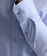 Model is wearing UNTUCKit wainwright shirt in blue.