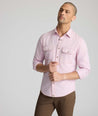 Model is wearing UNTUCKit Vintage Wash Western Shirt in pink.
