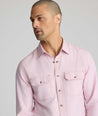 Model is wearing UNTUCKit Vintage Wash Western Shirt in pink.