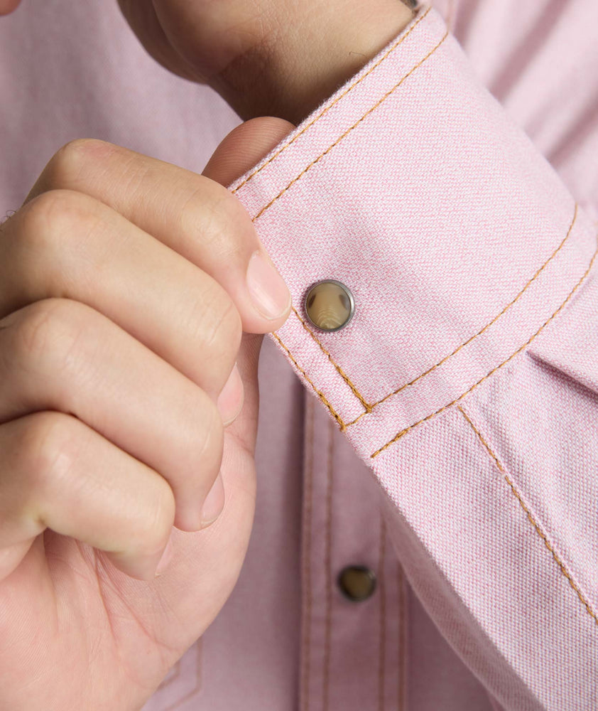 Model is wearing UNTUCKit Vintage Wash Western Shirt in pink.