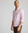 Model is wearing UNTUCKit Vintage Wash Western Shirt in pink.