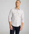 Model is wearing UNTUCKit Vintage Wash Western Shirt in tan.