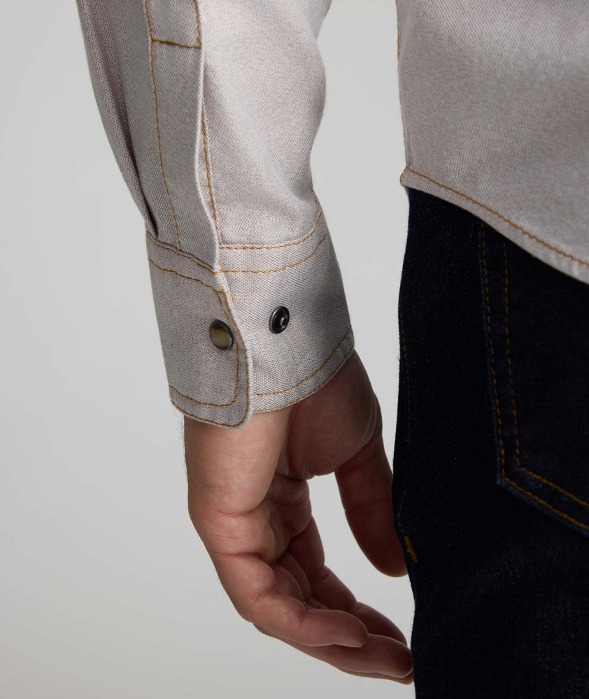 Model is wearing UNTUCKit Vintage Wash Western Shirt in tan.