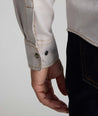 Model is wearing UNTUCKit Vintage Wash Western Shirt in tan.