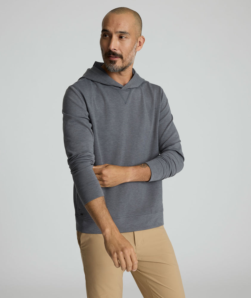 Model is wearing UNTUCKit weatherby performance hoodie. 