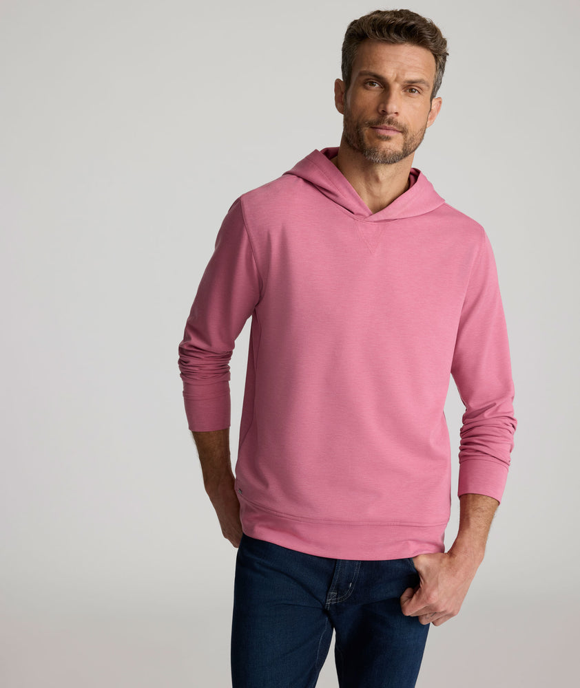 Model is wearing UNTUCKit Weatherby Performance Hoodie in Rose Wine.