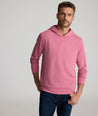 Model is wearing UNTUCKit Weatherby Performance Hoodie in Rose Wine.