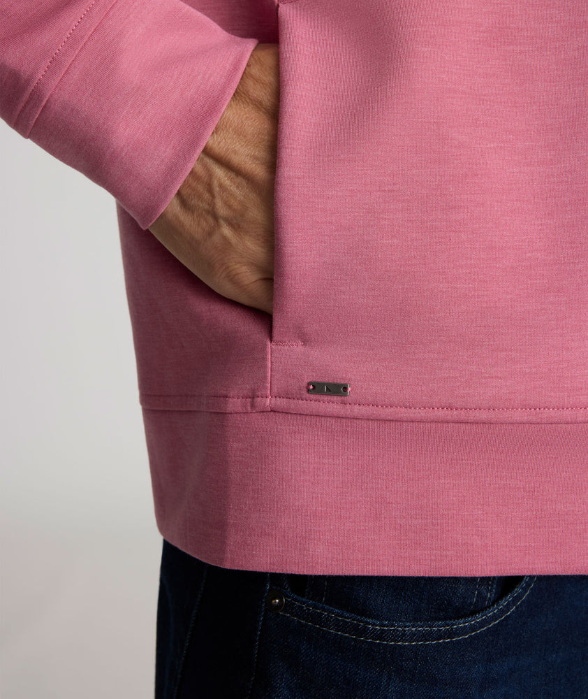 Model is wearing UNTUCKit Weatherby Performance Hoodie in Rose Wine.