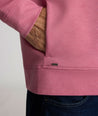 Model is wearing UNTUCKit Weatherby Performance Hoodie in Rose Wine.