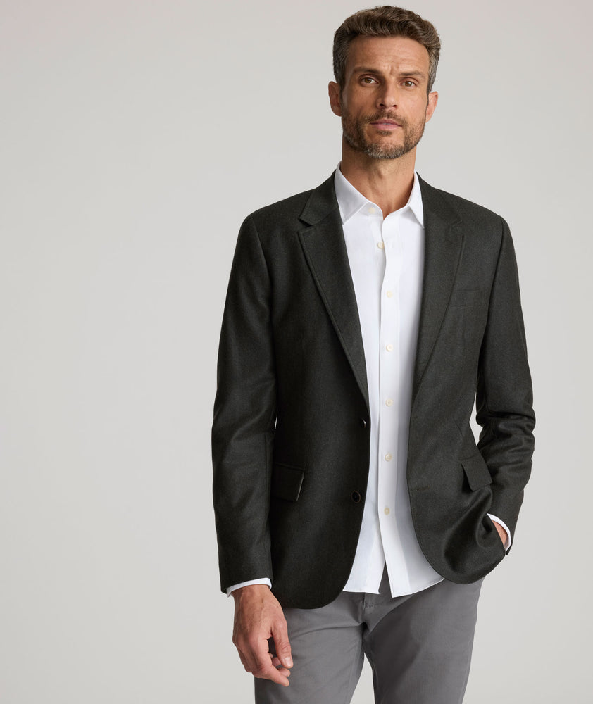 Model is wearing UNTUCKit Italian Wool Westerling Sport Coat in Olive. 