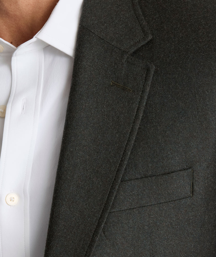 Model is wearing UNTUCKit Italian Wool Westerling Sport Coat in Olive. 