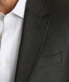 Model is wearing UNTUCKit Italian Wool Westerling Sport Coat in Olive. 