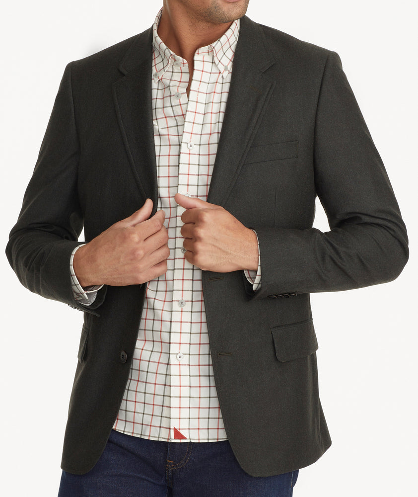 Model is wearing UNTUCKit Italian Wool Westerling Sport Coat in Olive. 