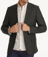 Model is wearing UNTUCKit Italian Wool Westerling Sport Coat in Olive. 