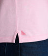 Model is wearing UNTUCKit westray henley in stripe pink. 