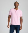 Model is wearing UNTUCKit westray henley in stripe pink. 
