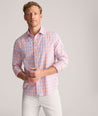 Model is wearing UNTUCKit Performance Whitman Shirt in Pink & Blue Plaid.